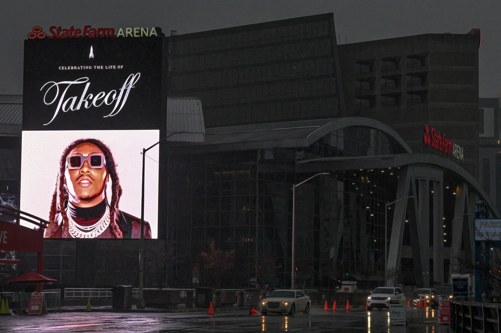 EXCLUSIVE: Large screen lights up Atlanta's State Farm Arena on morning of rapper Takeoff's funeral.