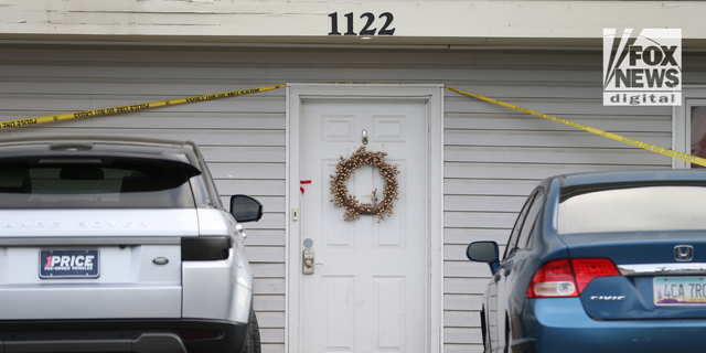 Investigators search a home in Moscow, Idaho, on Nov. 14, 2022, after four University of Idaho students were killed there on Nov. 13.