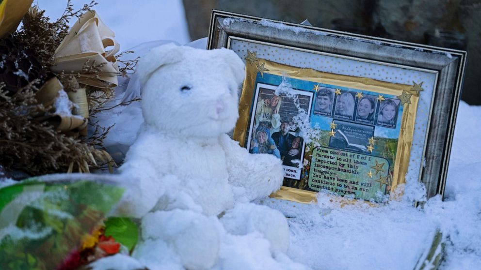 PHOTO: Flowers, a stuffed animal, and a framed image featuring the photos of the four students found dead at a house on Nov. 13, 2022 in Moscow, Idaho, rest in the snow in front of the house on Nov. 29, 2022. 