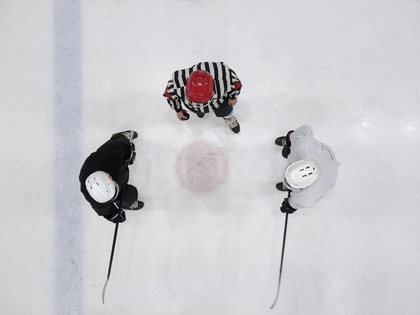 A group of hockey players on ice

Description automatically generated